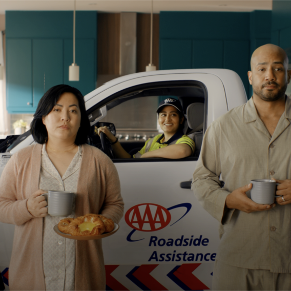 women and man in front of women in truck